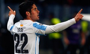 Malaga's Isco celebrates after scoring a against Porto during their Champions League match in Malaga